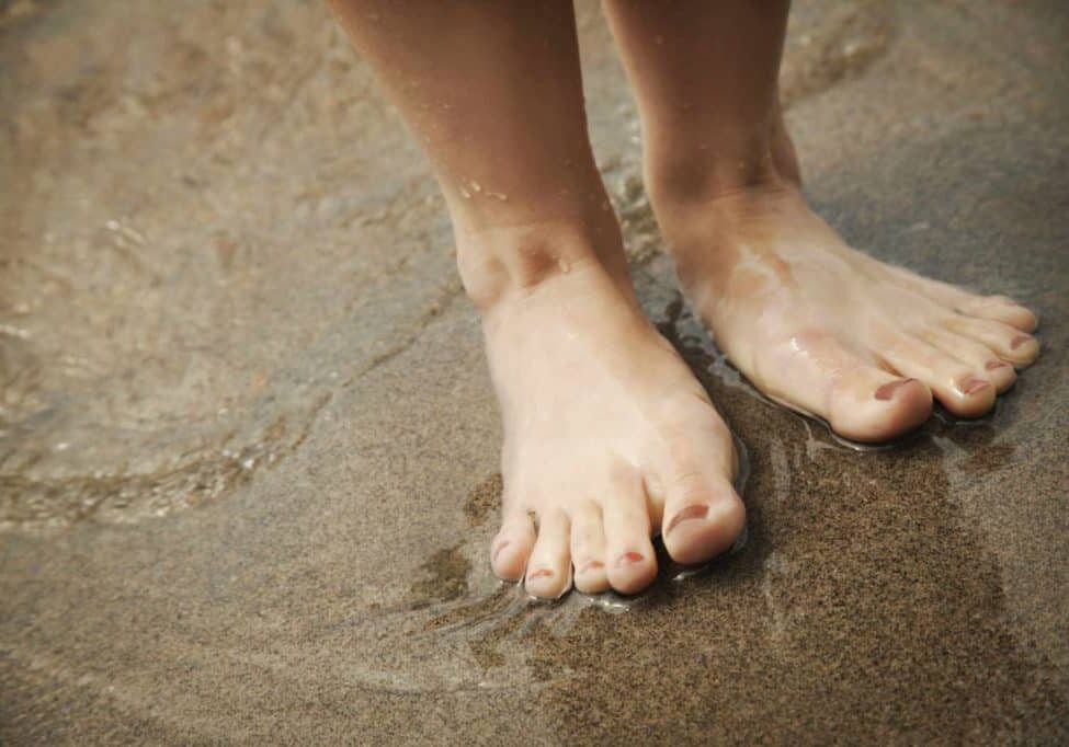 grounding exercise barefoot on beach